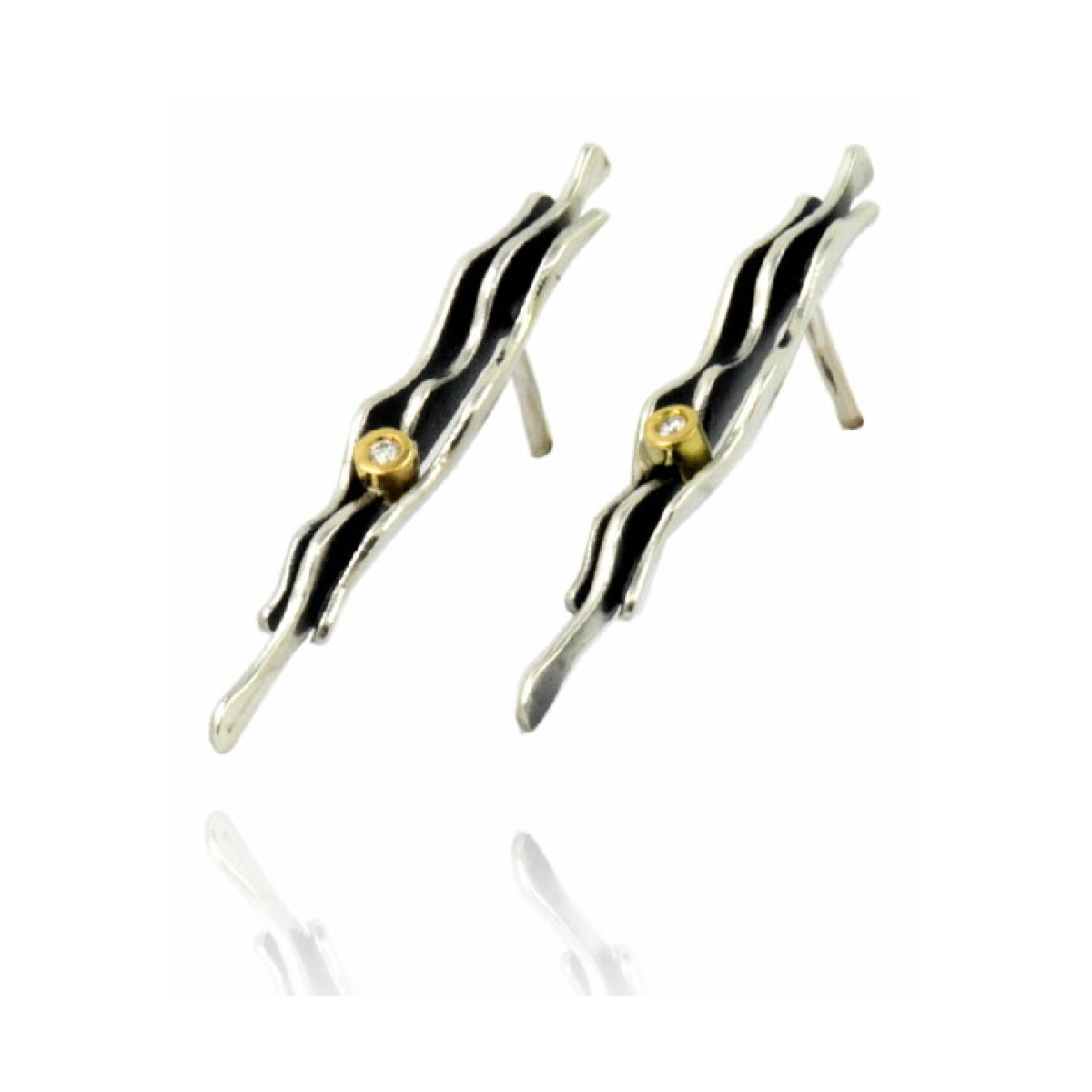 Fi silver& gold big earrinig van Arior Barcelona